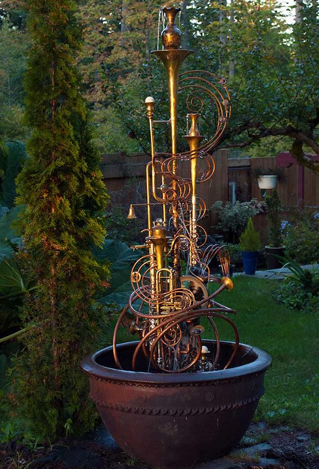 Musical Instrument fountain made from upcycled items including copper tube, a water wheel, a sax, a trumpet, a flute and an assortment of copper and brass collectable.  It comes complete with pump. This fountain is currently available for purchase @ $ 2,400. Please call or email for further info and shipping details. 