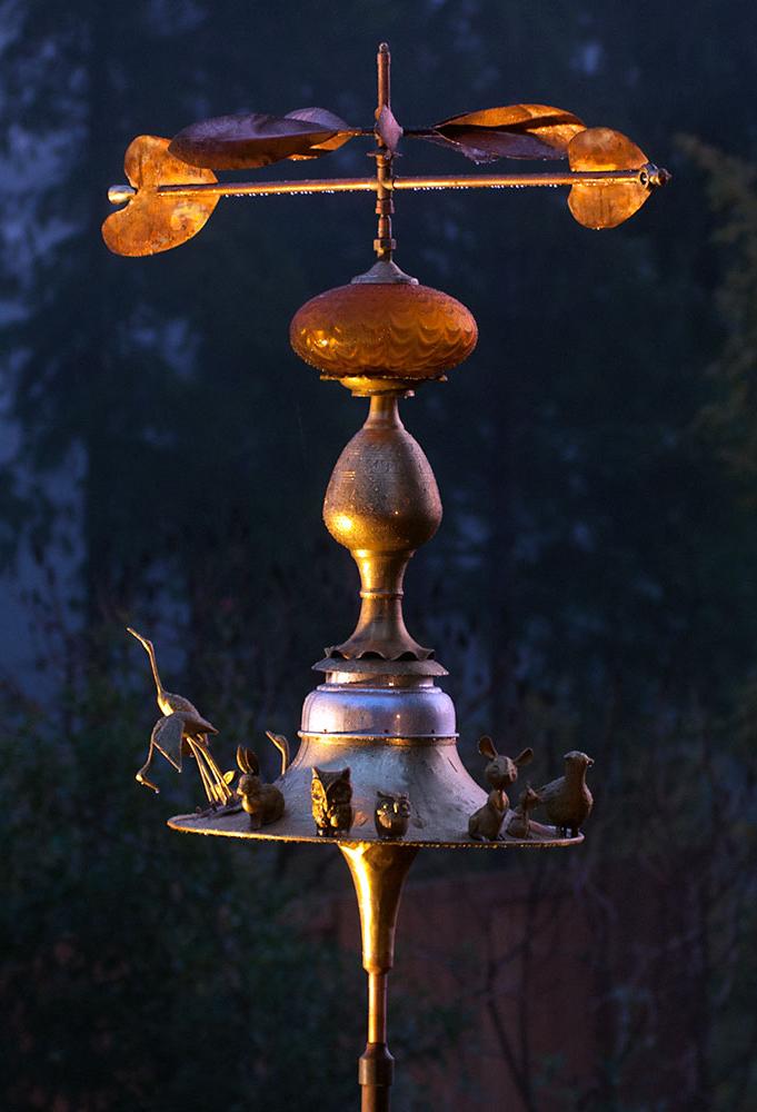 Weather vane made from an upcycled trumpet, a sousaphone bell and brass and copper. 